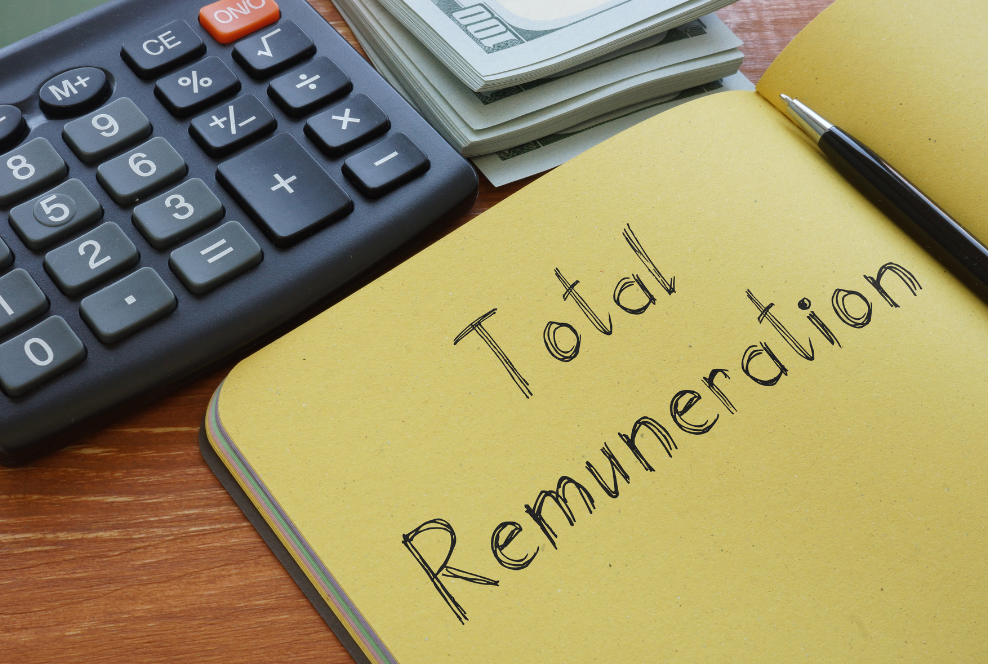 Note pad with Total Remuneration written and calculator